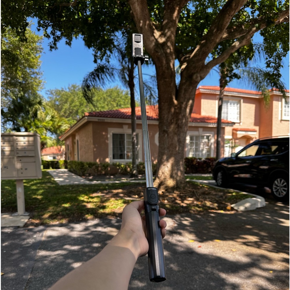 new unused foldable tripod with bluetooth microphone